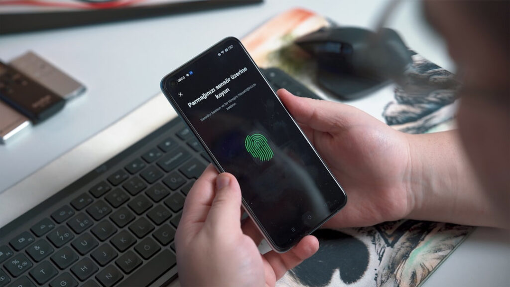 Alt text: A phone screen showing an account verification step beside an ID card